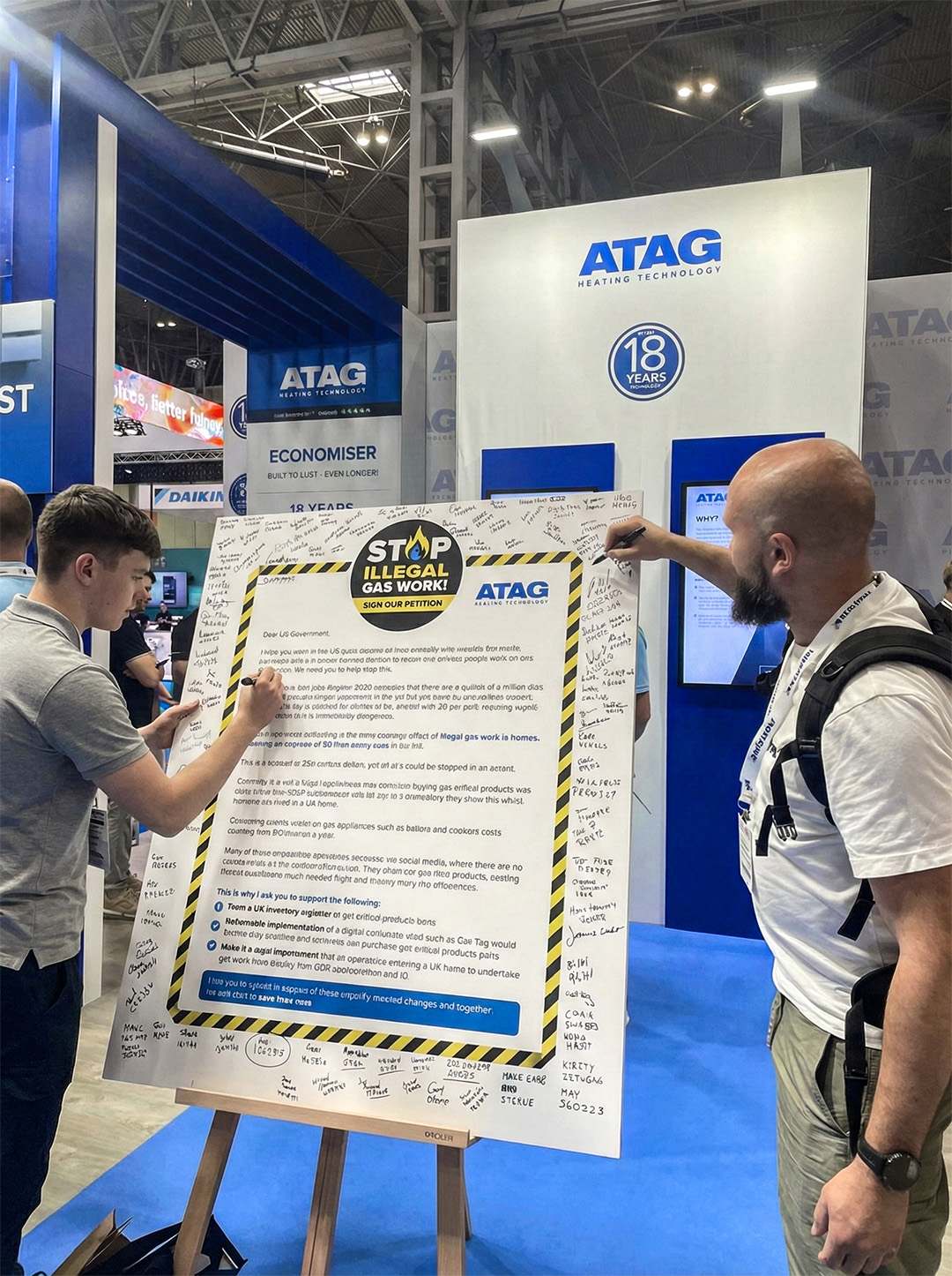 Image of people signing the petition